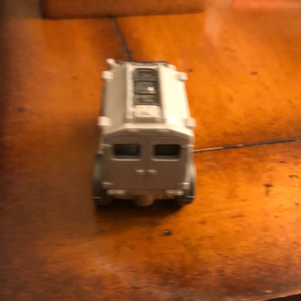 Blurry Black Item with Dark Green and Purple Hues